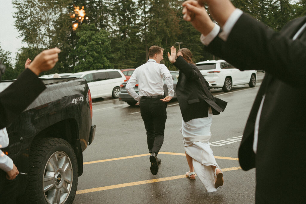 bride and groom running off from sparkler exit