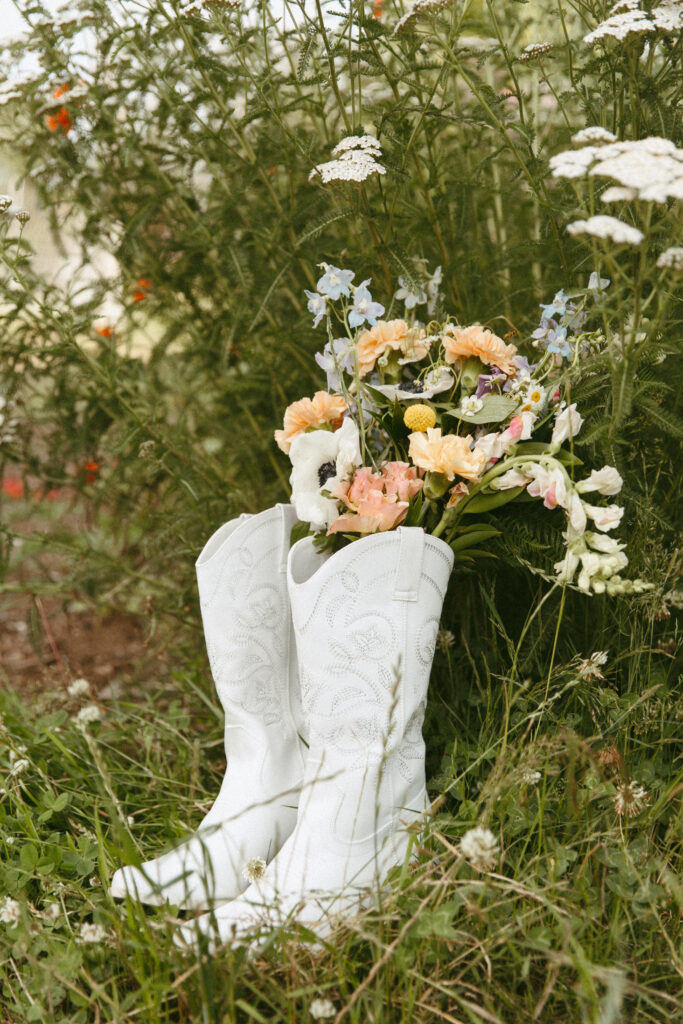 Bridal bouquet in bridal cowgirl boots