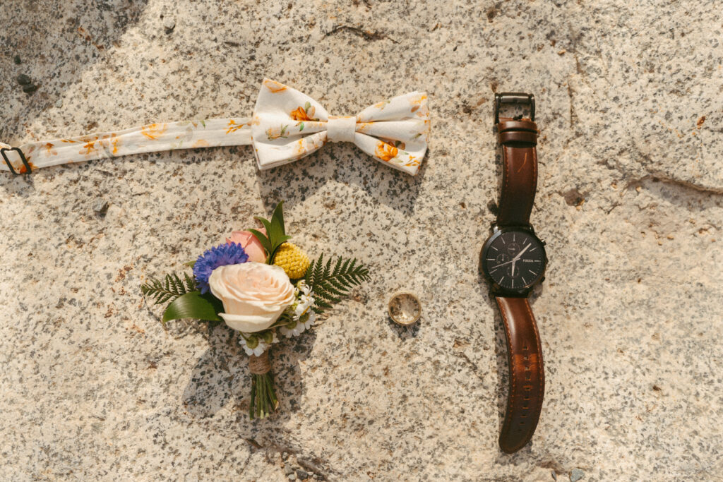 Groom ring, boutonniere, and ring details