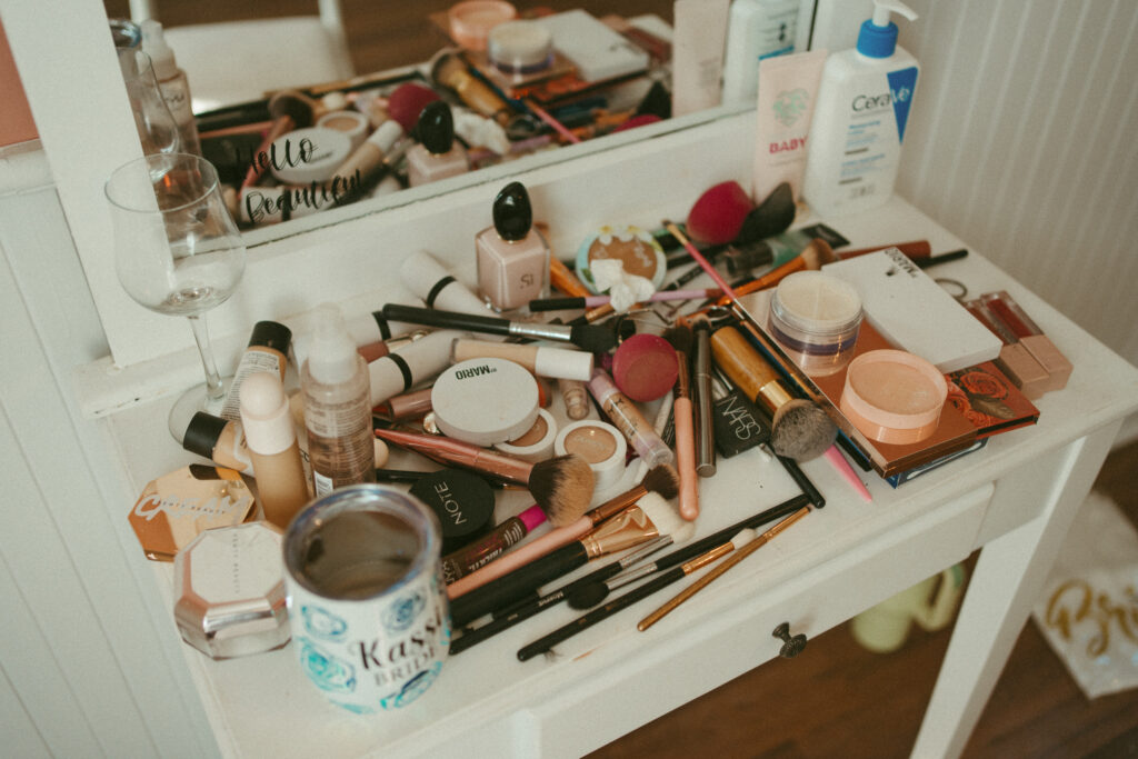 getting ready makeup brushes and hair spray 