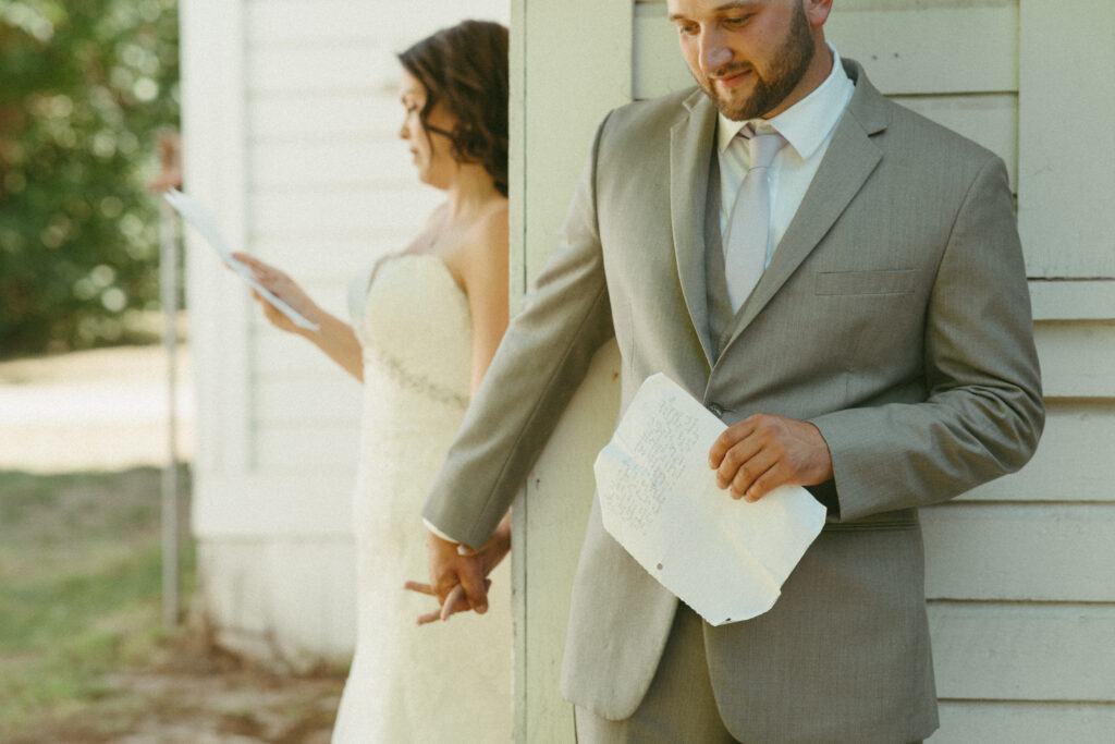 first touch with bride and groom reading private vows