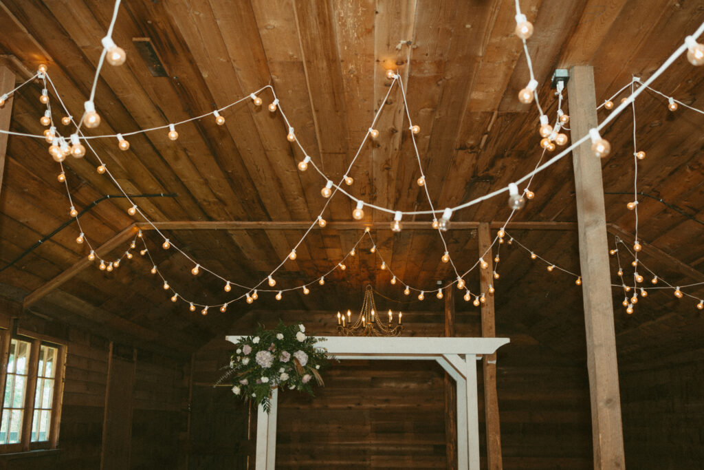 string lights in the reception barn at Estate 248