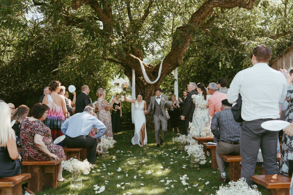 sunny ceremony on the lawn at Estate 248