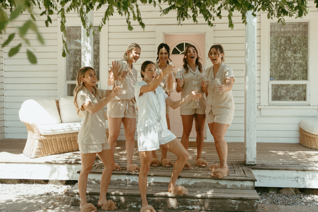 bridal party getting ready with a champagne pop before the ceremony at Estate 248